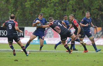 FNB NMMU turned in a gutsy performance to take the win against FNB Wits in wet and slippery conditions on Monday night. Photo: Wessel Oosthuizen/SASPA