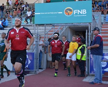 FNB Madibaz captain Roy Godfrey leads his team onto the field for Tuesday night’s clash against the Cheetahs. Photo: Full Stop Communications