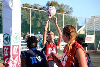 SPAR-NMMU's Eileen van Zyl takes aim during the season-opening SPAR-NMMU Netball Tournament at the 2nd Avenue Campus in Port Elizabeth on Saturday. The hosts won three of the five pool finals, as well as the men's section. Photo: Richard Huggard